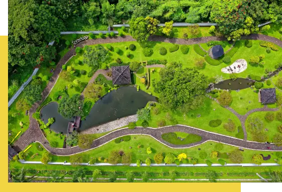 A bird 's eye view of a park with trees and water.