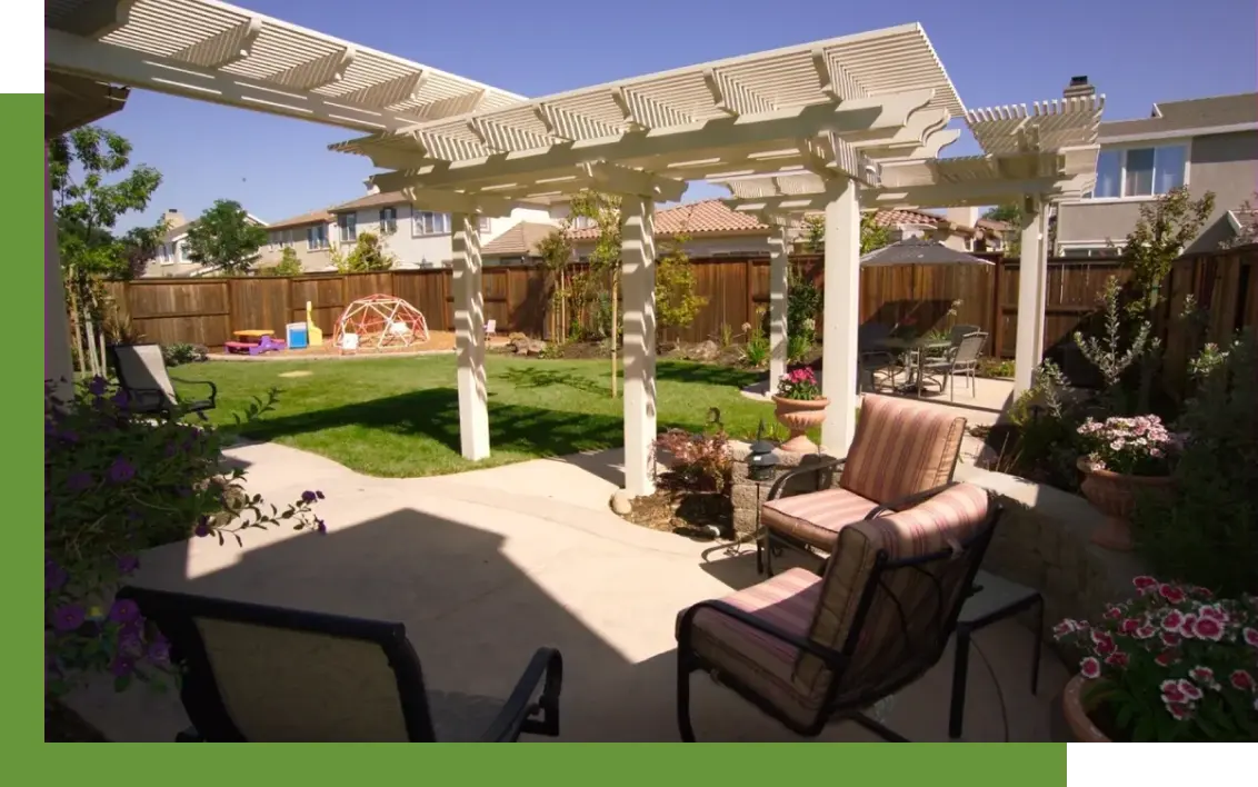 A patio with chairs and tables in the middle of it.